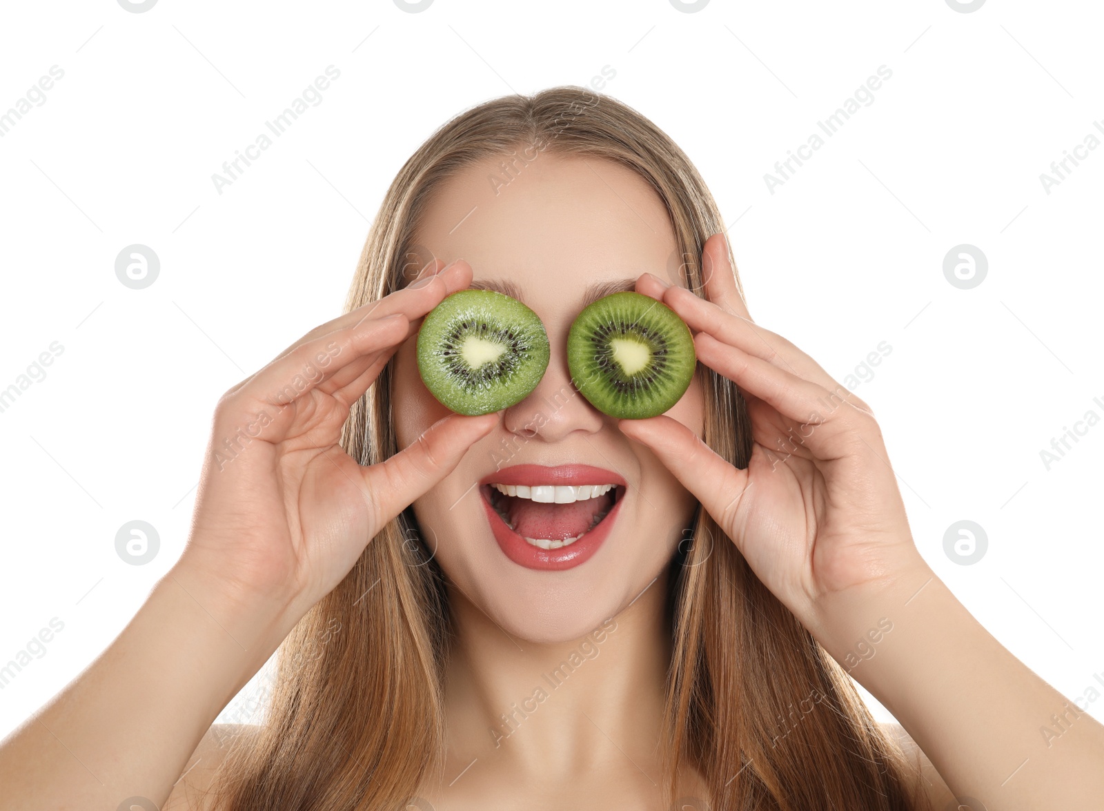 Photo of Young woman with cut kiwi on white background. Vitamin rich food