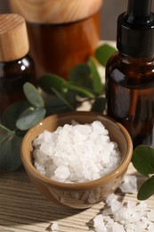 Composition with spa products and eucalyptus leaves on wooden table