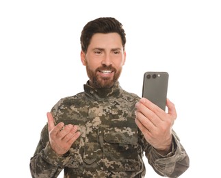 Photo of Happy soldier using video chat on smartphone against white background. Military service