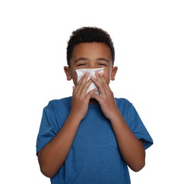 Photo of African-American boy blowing nose in tissue on white background. Cold symptoms