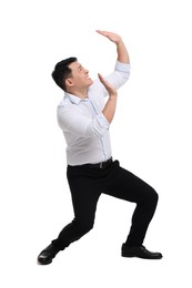 Photo of Scared businessman in formal clothes posing on white background