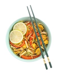 Photo of Stir-fry. Delicious cooked noodles with chicken and vegetables in bowl isolated on white, top view