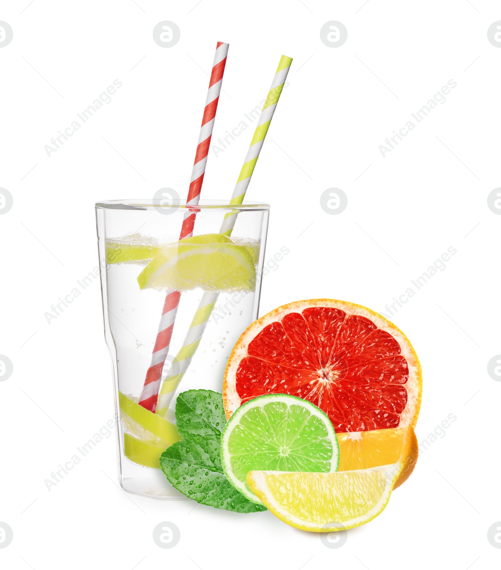 Image of Glass with tasty lemonade, fresh ripe citrus fruits and green leaves on white background