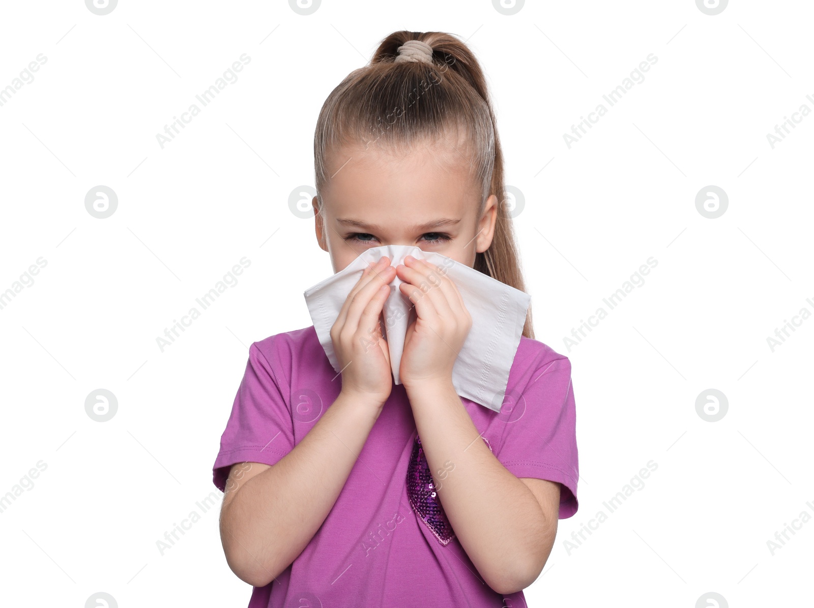 Photo of Sick girl blowing nose in tissue on white background. Cold symptoms