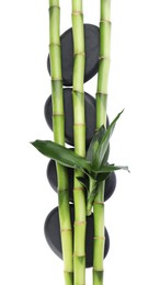 Spa stones and bamboo on white background, top view