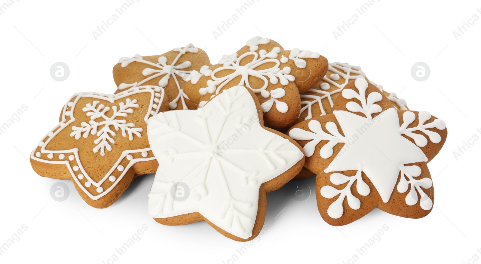 Photo of Tasty star shaped Christmas cookies with icing isolated on white
