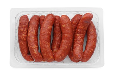 Plastic container with sausages isolated on white, top view. Meat product