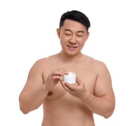 Photo of Handsome man with jar of body cream on white background