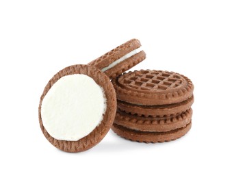 Photo of Tasty chocolate sandwich cookies with cream on white background