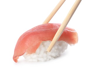 Photo of Chopsticks with delicious nigiri sushi isolated on white