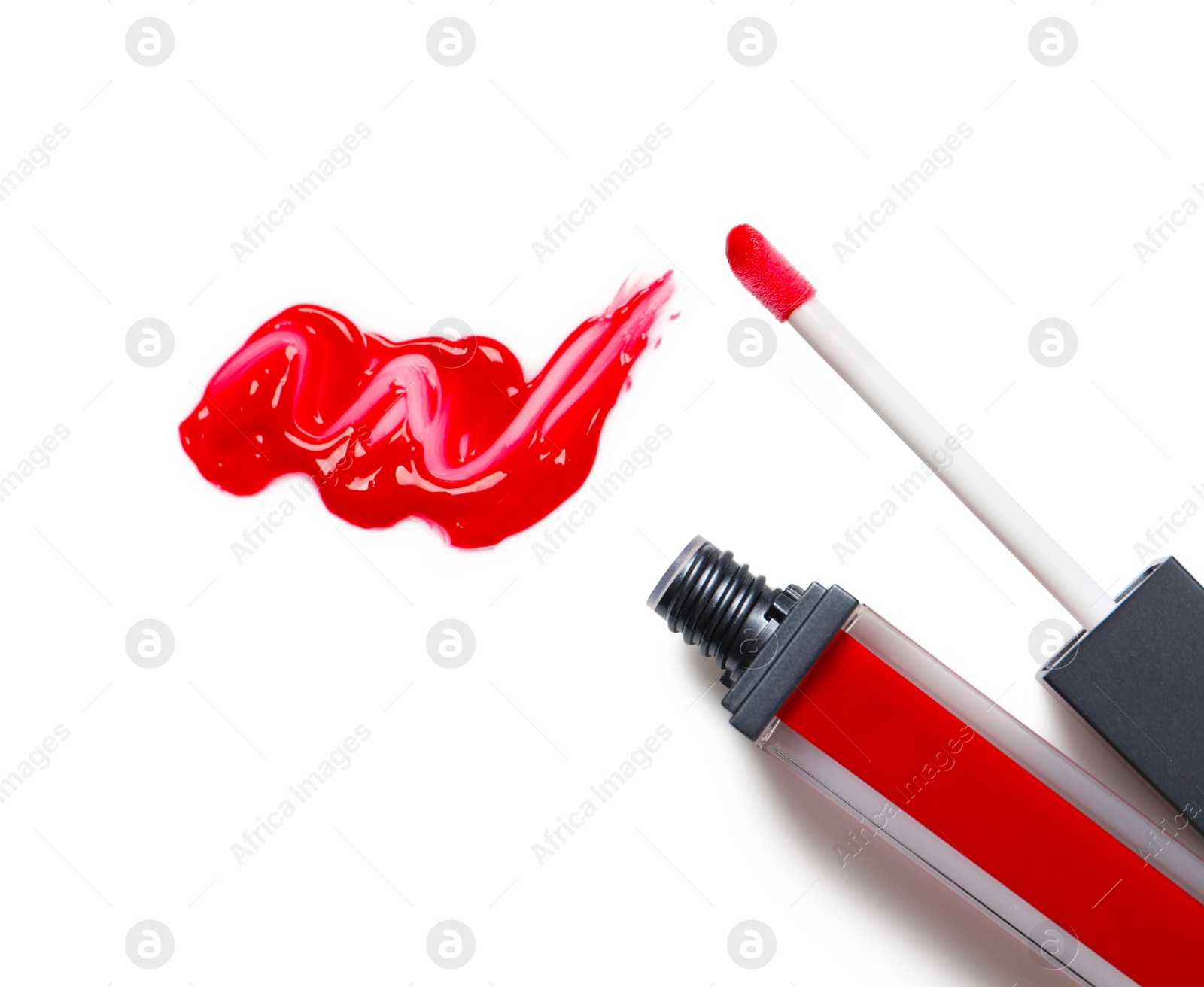 Photo of Red liquid lipstick with smear and applicator isolated on white, top view