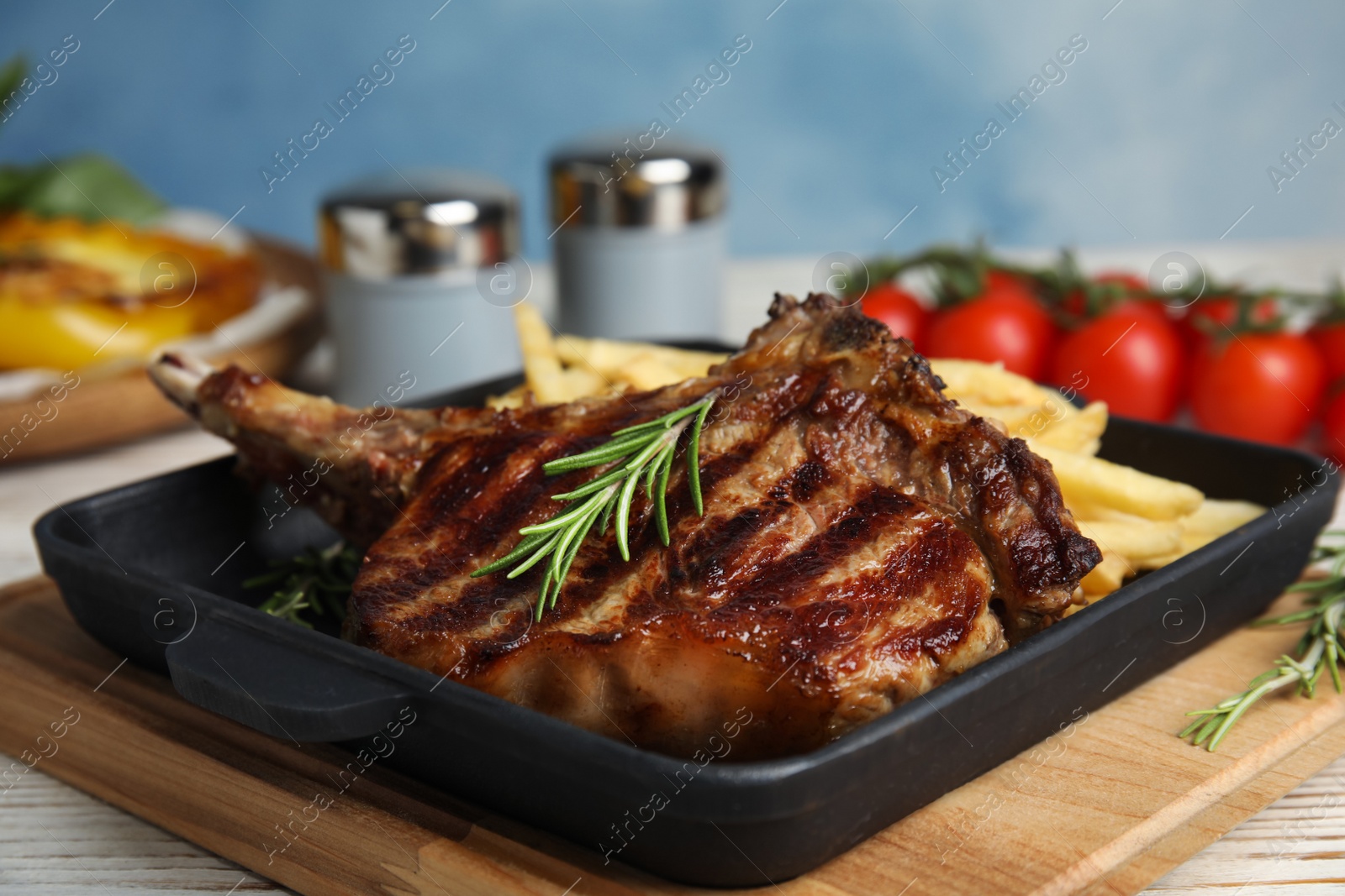 Photo of Tasty grilled beef steak on white table, closeup