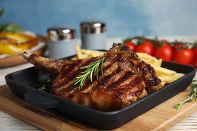 Photo of Tasty grilled beef steak on white table, closeup