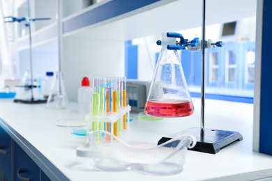 Photo of Chemical glassware on table indoors. Laboratory analysis