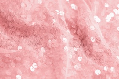 Photo of Beautiful pink fabric with shiny sequins as background, closeup