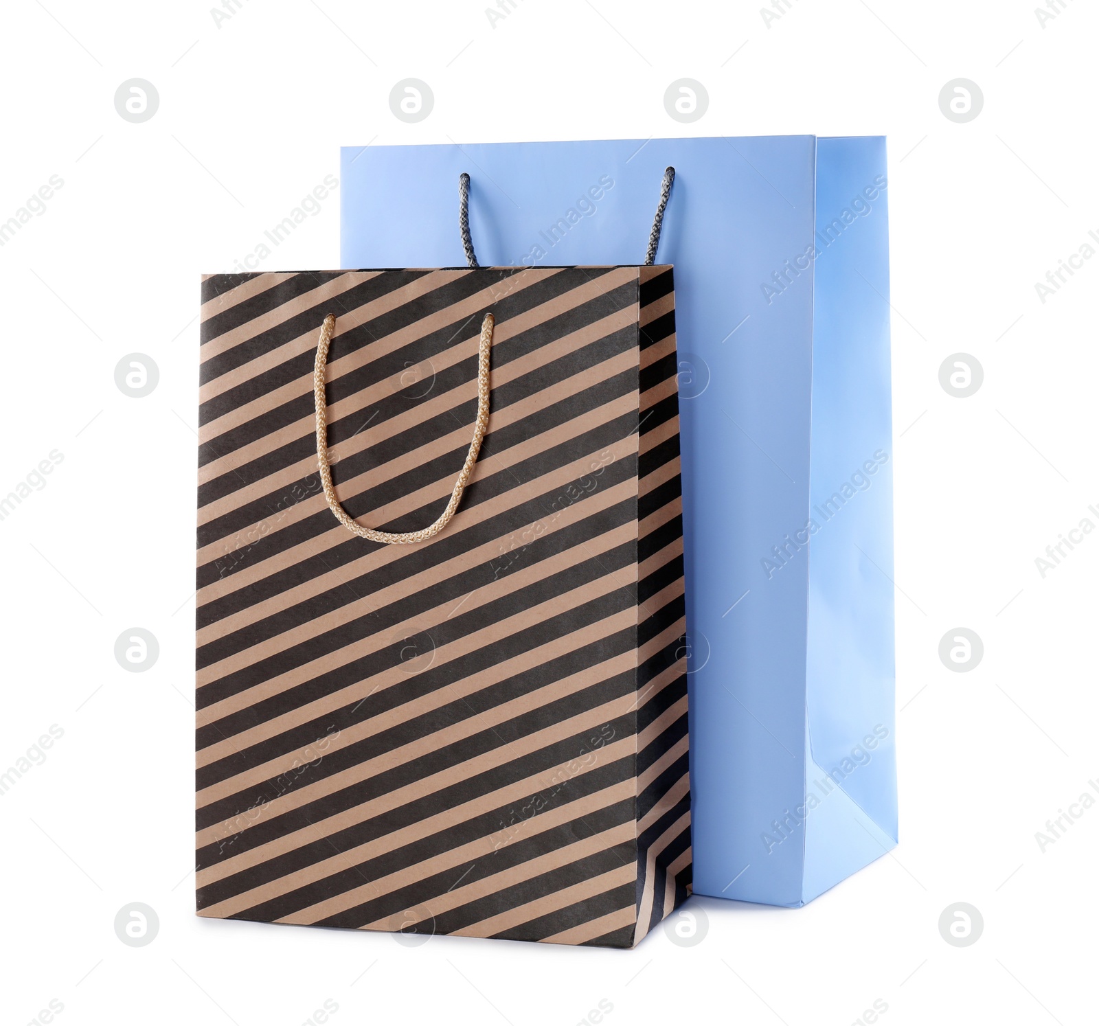 Photo of Colorful paper shopping bags isolated on white