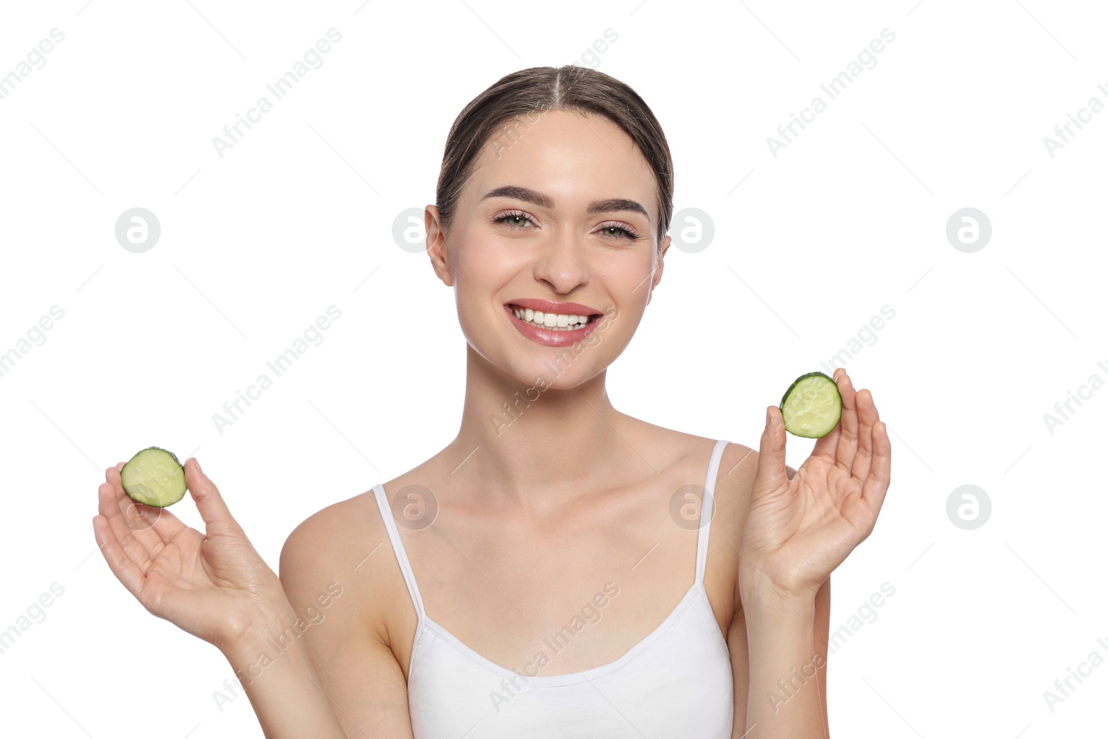 Photo of Young woman with cucumber slices on white background. Eye skin care
