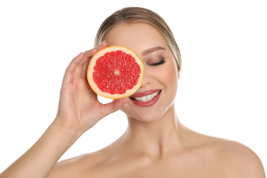 Photo of Young woman with cut grapefruit on white background. Vitamin rich food