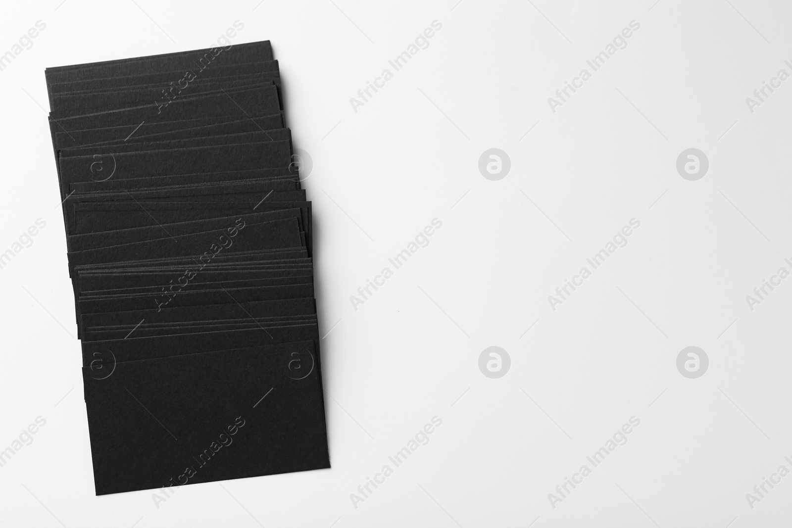 Photo of Blank black business cards on white background, top view. Mockup for design