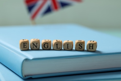 Photo of Beads with word ENGLISH on book, closeup