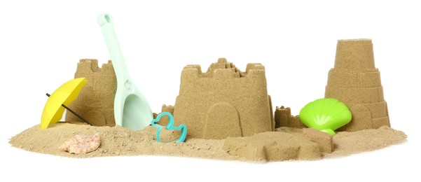 Photo of Pile of sand with beautiful castles, shell and plastic beach toys isolated on white