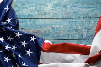 American flag on wooden background, top view with space for text