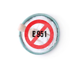 Image of Forbidding aspartame. Prohibition sign with code (E951) over artificial sweetener in bowl on white background, top view