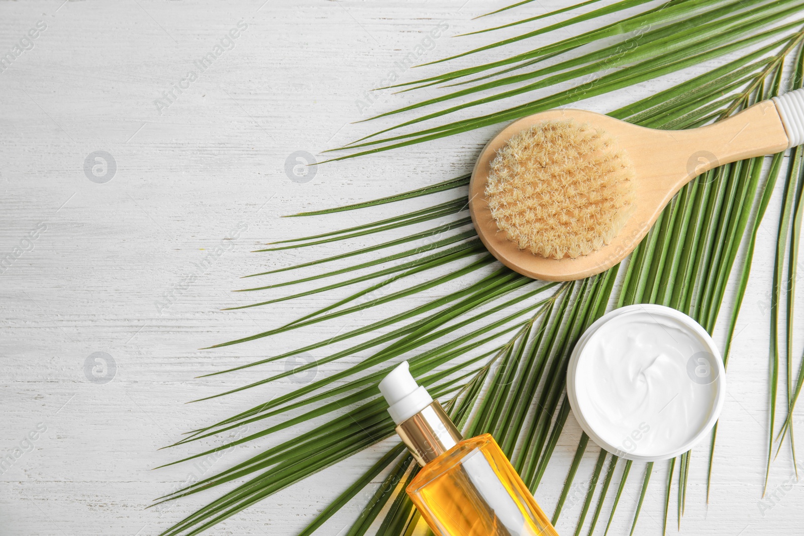 Photo of Flat lay composition with different body care products and space for text on white wooden background