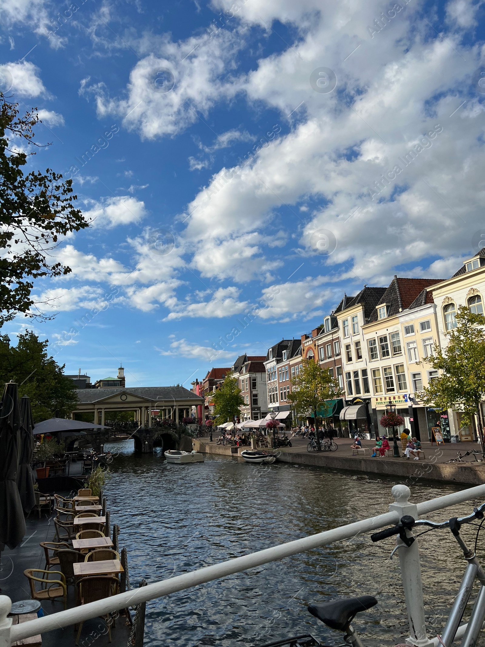 Photo of Beautiful view of buildings near canal in city under cloudy sky