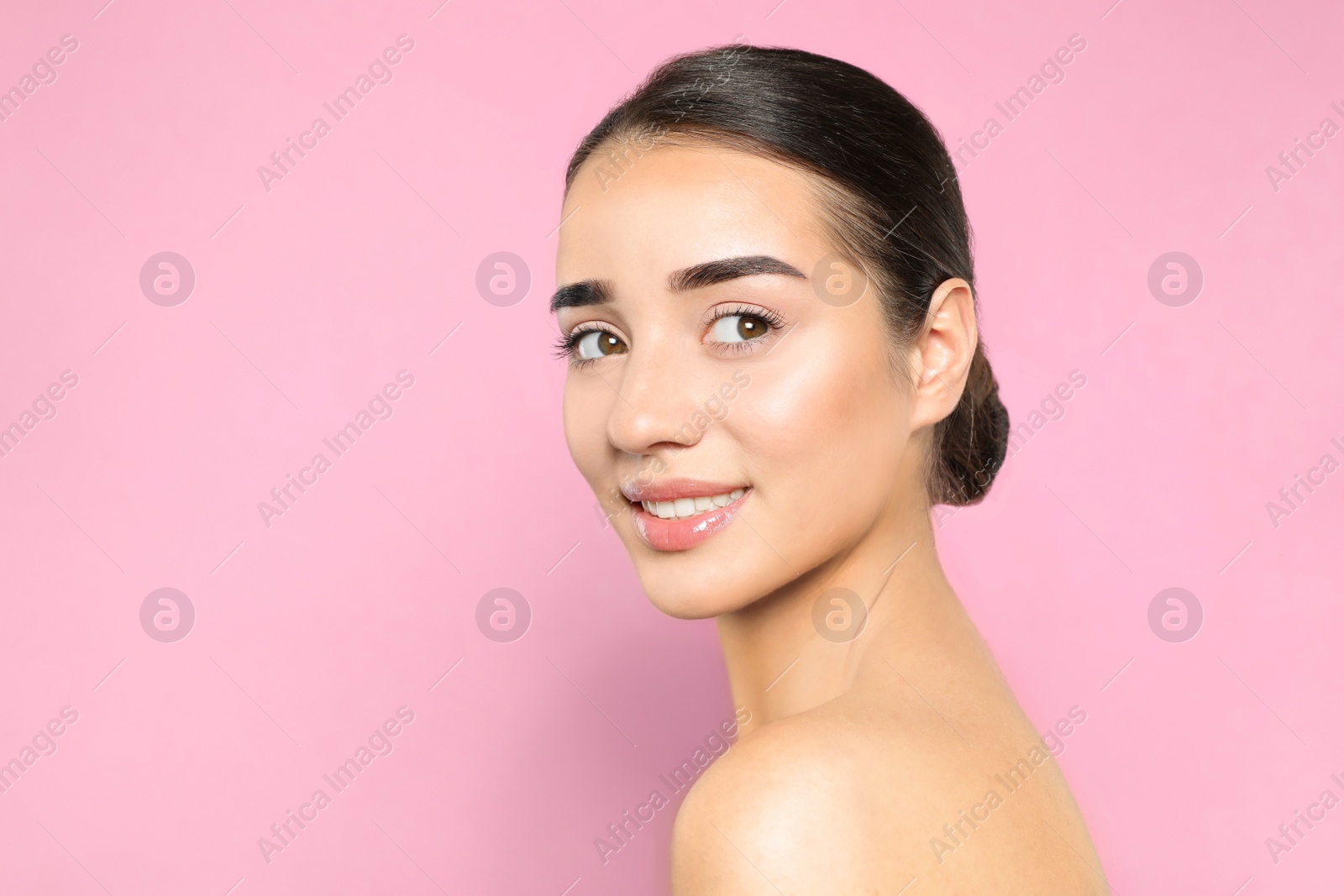 Photo of Portrait of young woman with beautiful face against color background. Space for text