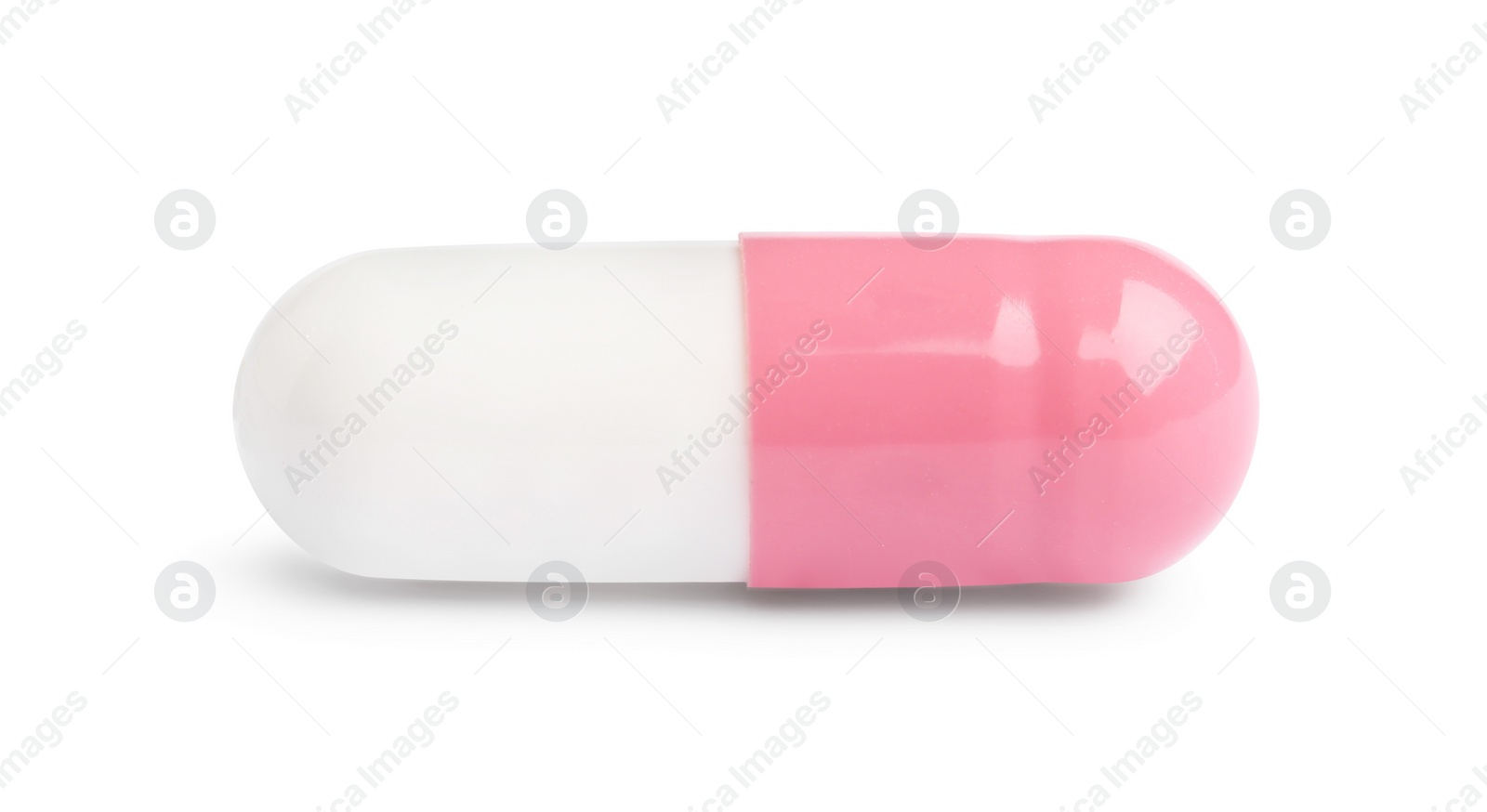 Photo of One pill on white background. Medicinal treatment