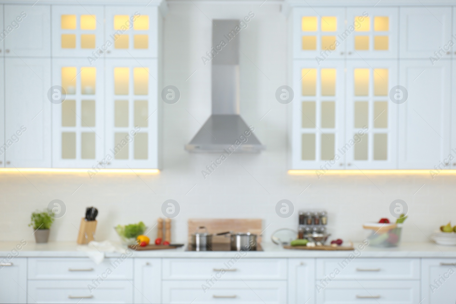 Photo of Blurred view of modern kitchen interior with stylish furniture