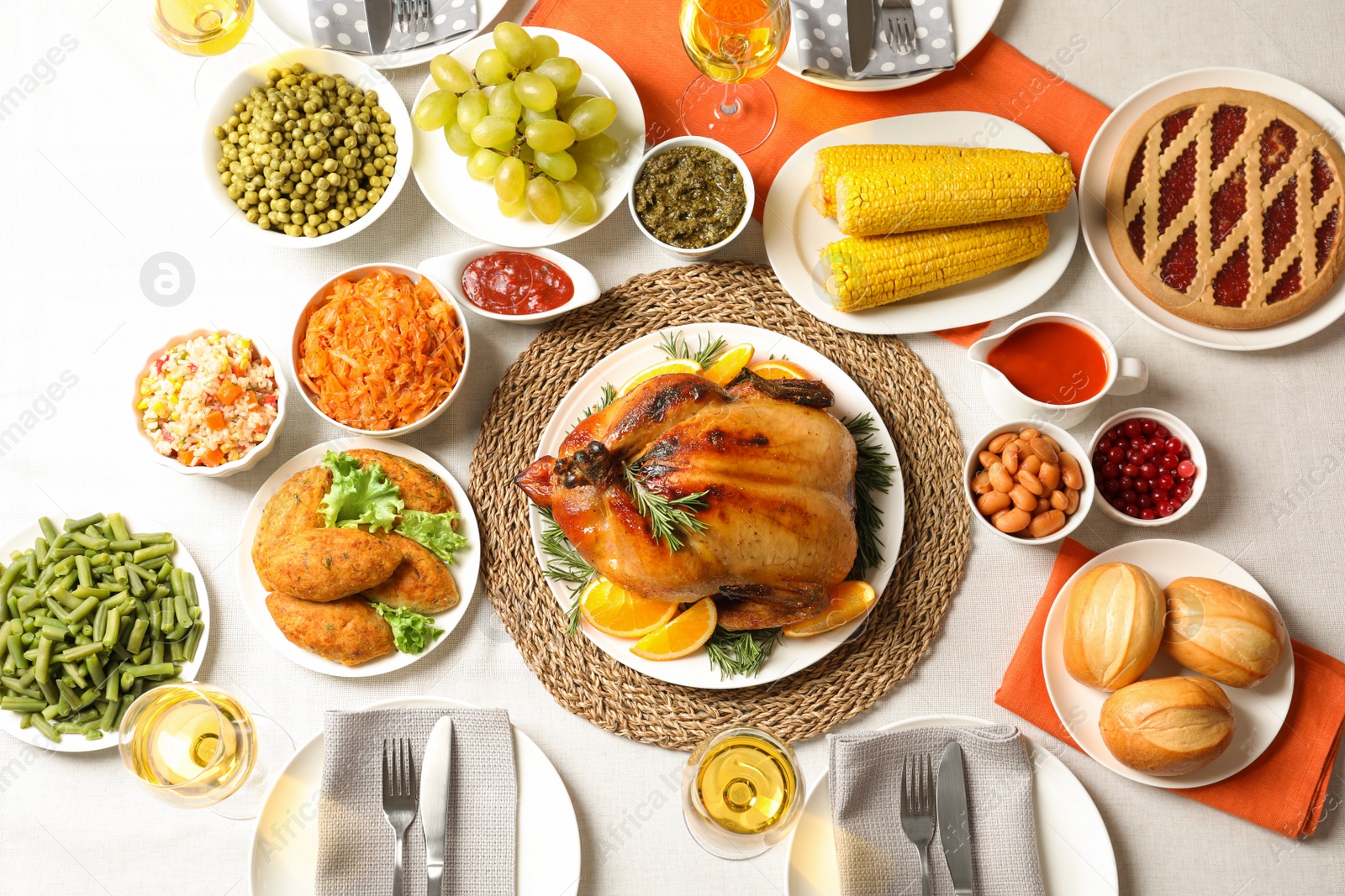 Photo of Delicious festive dinner with roasted turkey on table, flat lay