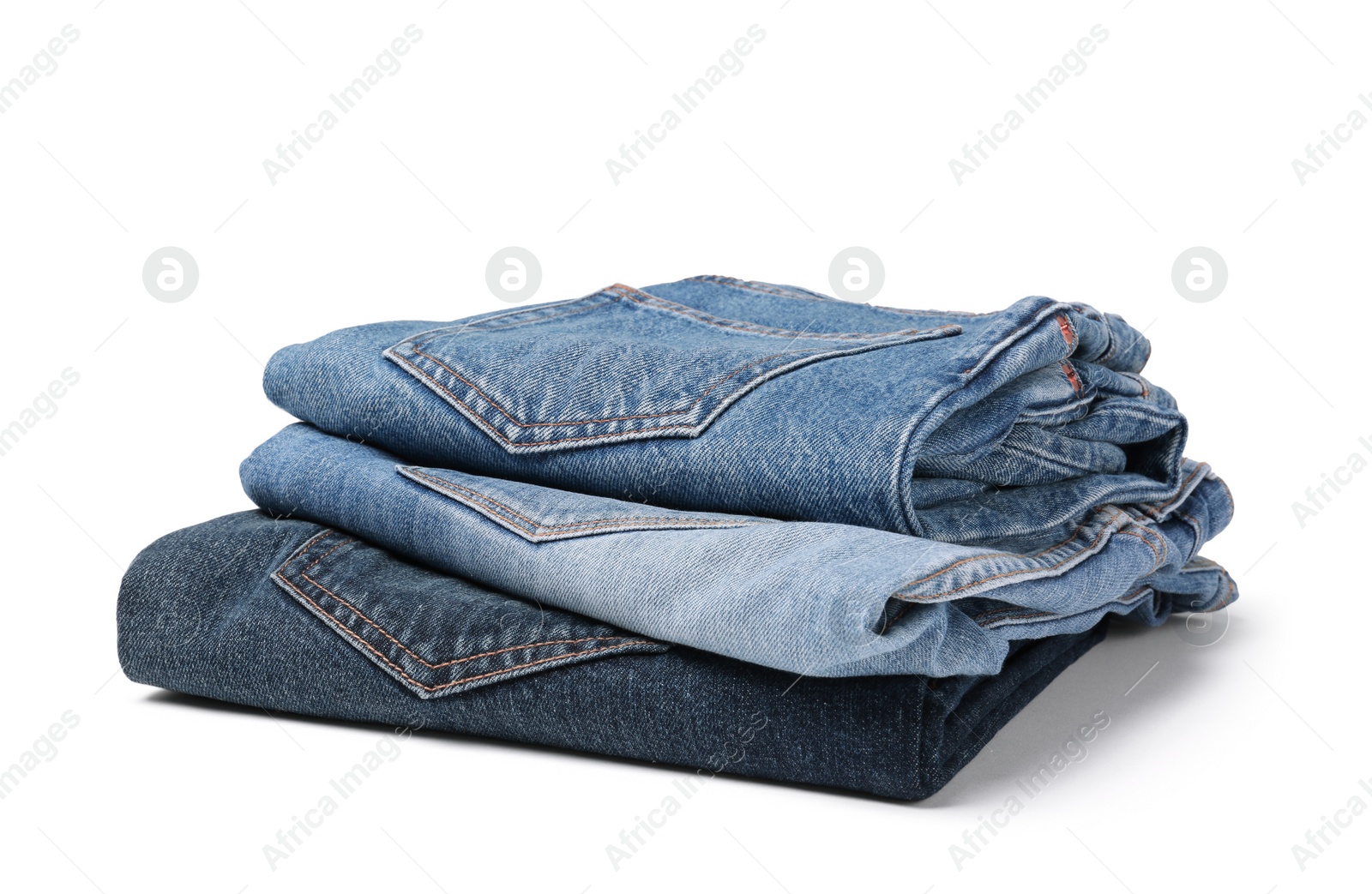 Image of Stack of different folded jeans isolated on white