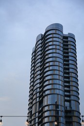 Photo of Low angle view of modern building with many windows