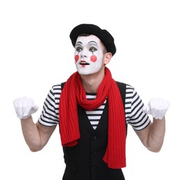 Funny mime artist in beret posing on white background