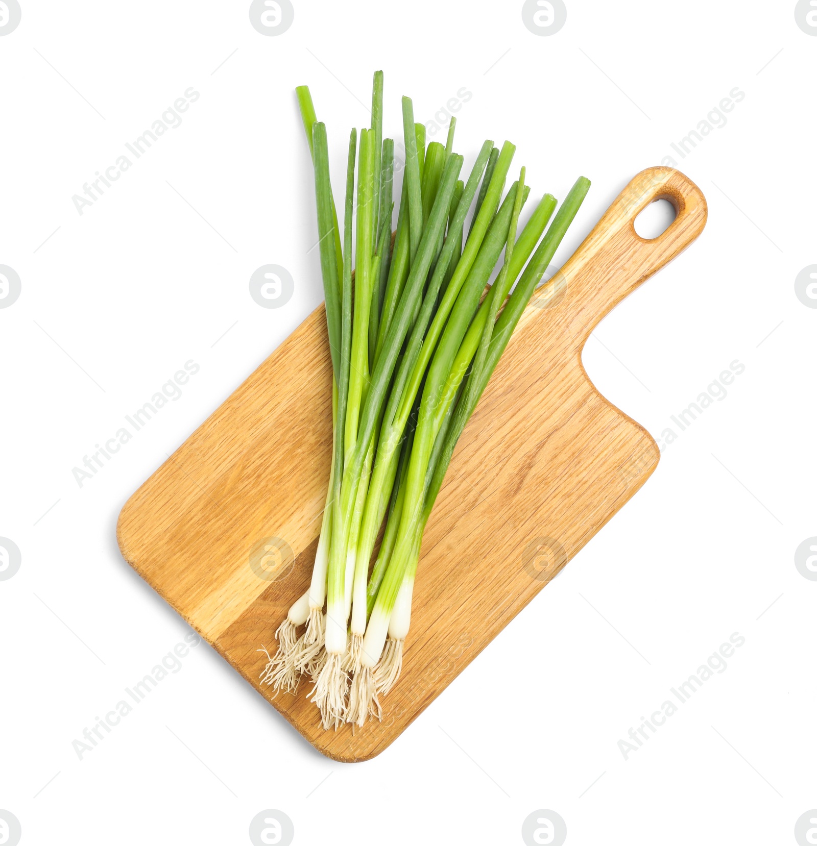 Photo of Wooden board with fresh green spring onions on white background, top view