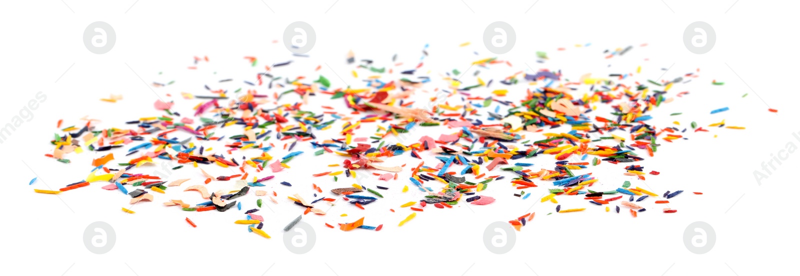 Photo of Colorful graphite crumbs on white background. Pencil sharpening