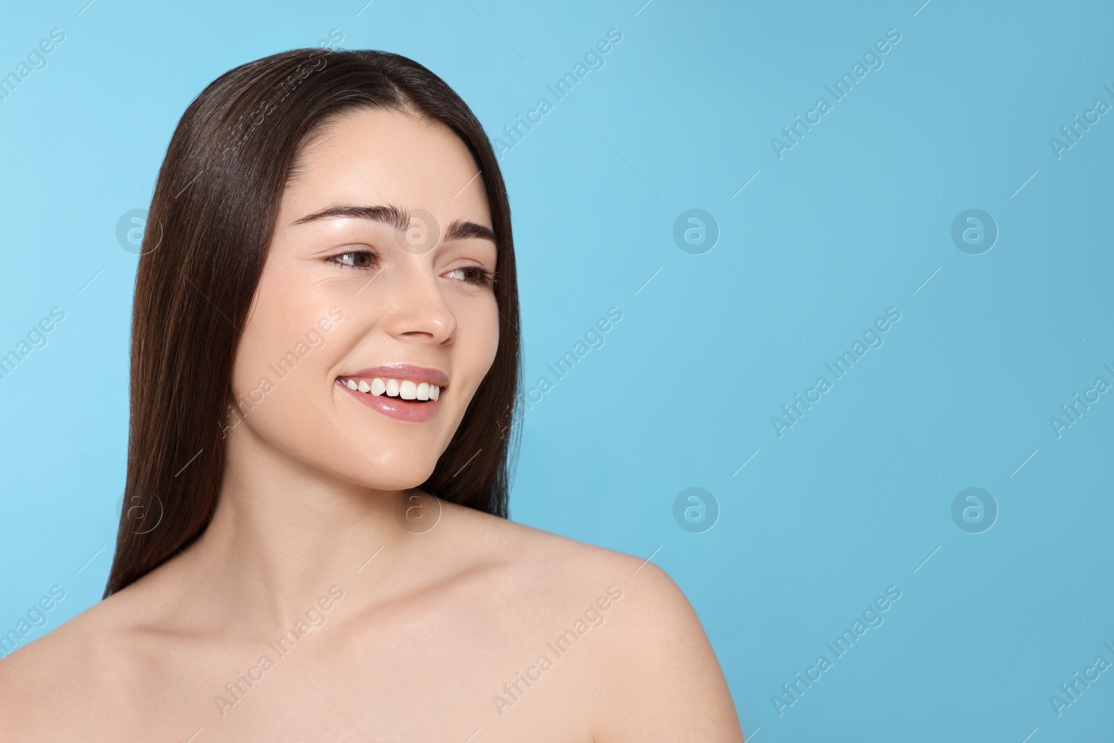 Photo of Portrait of attractive young woman on light blue background, space for text. Spa treatment