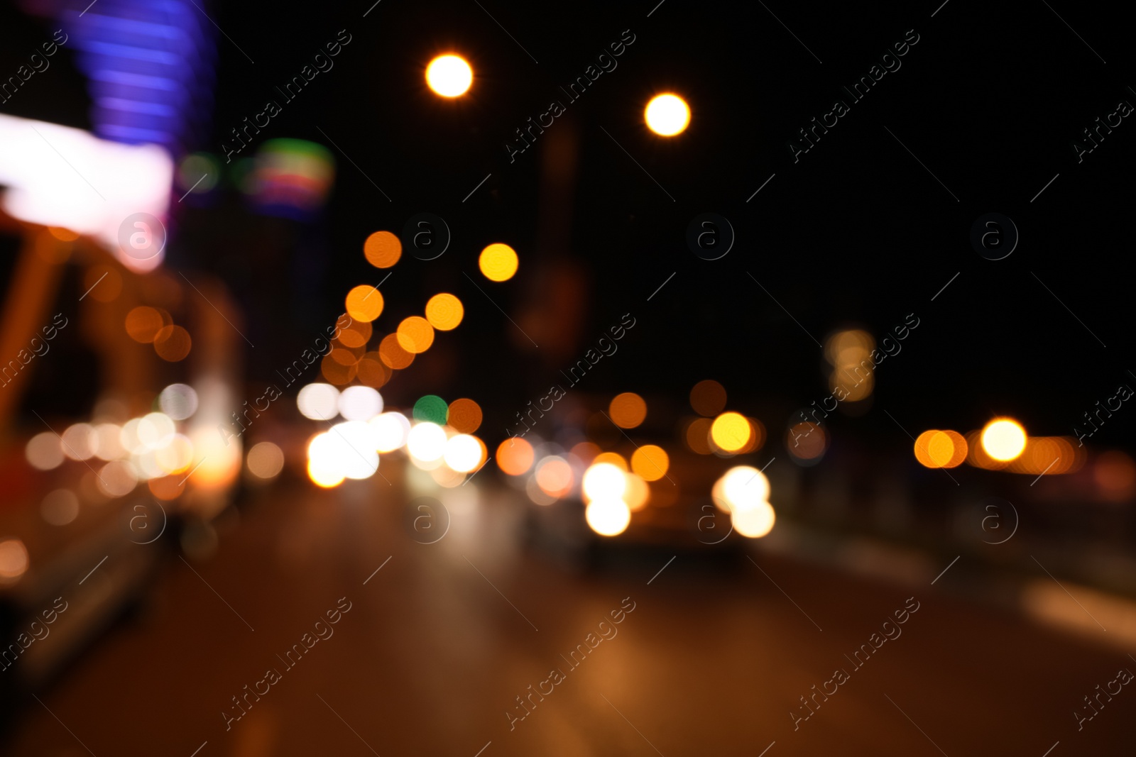 Photo of Blurred view of cityscape with bokeh effect. Night life