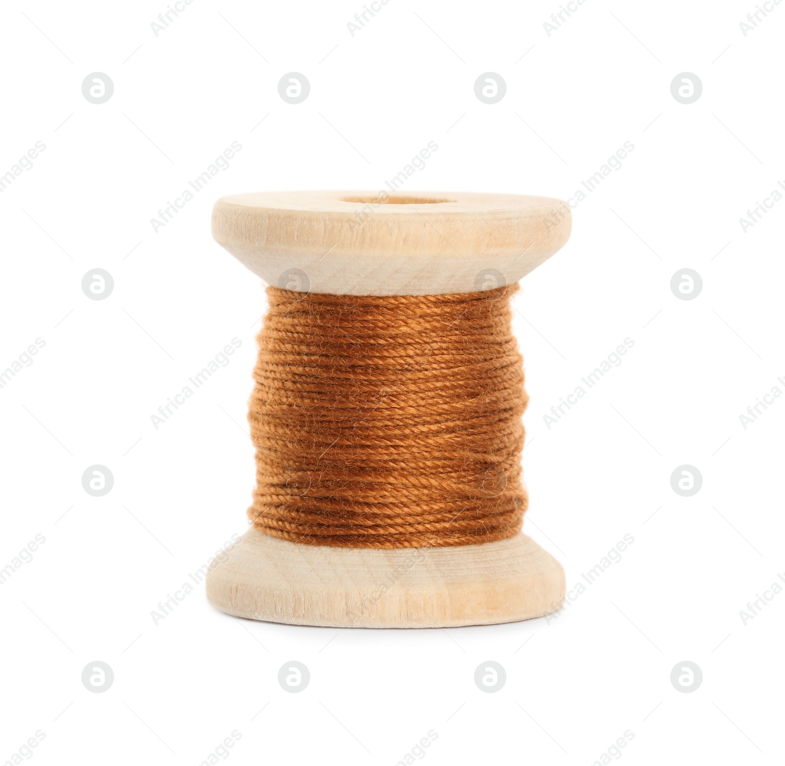 Photo of Wooden spool of dark orange sewing thread isolated on white