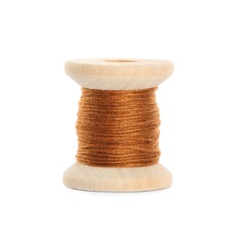 Photo of Wooden spool of dark orange sewing thread isolated on white