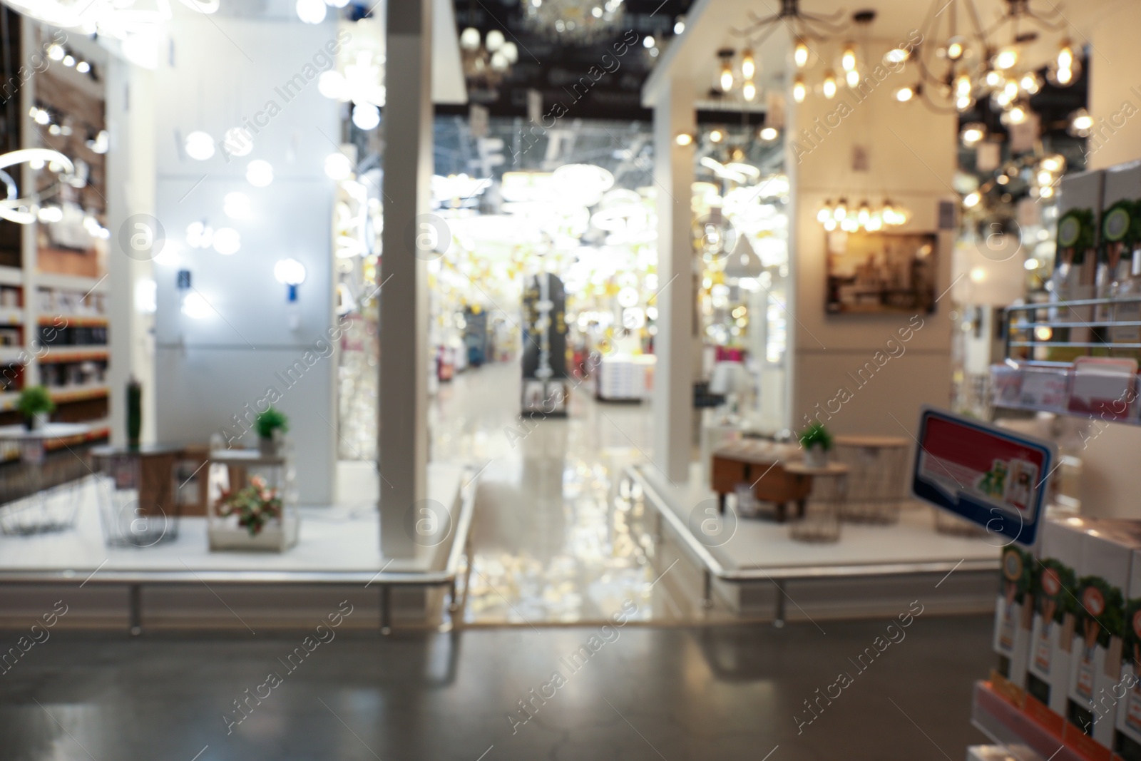 Photo of Blurred view of lighting store in shopping mall. Bokeh effect