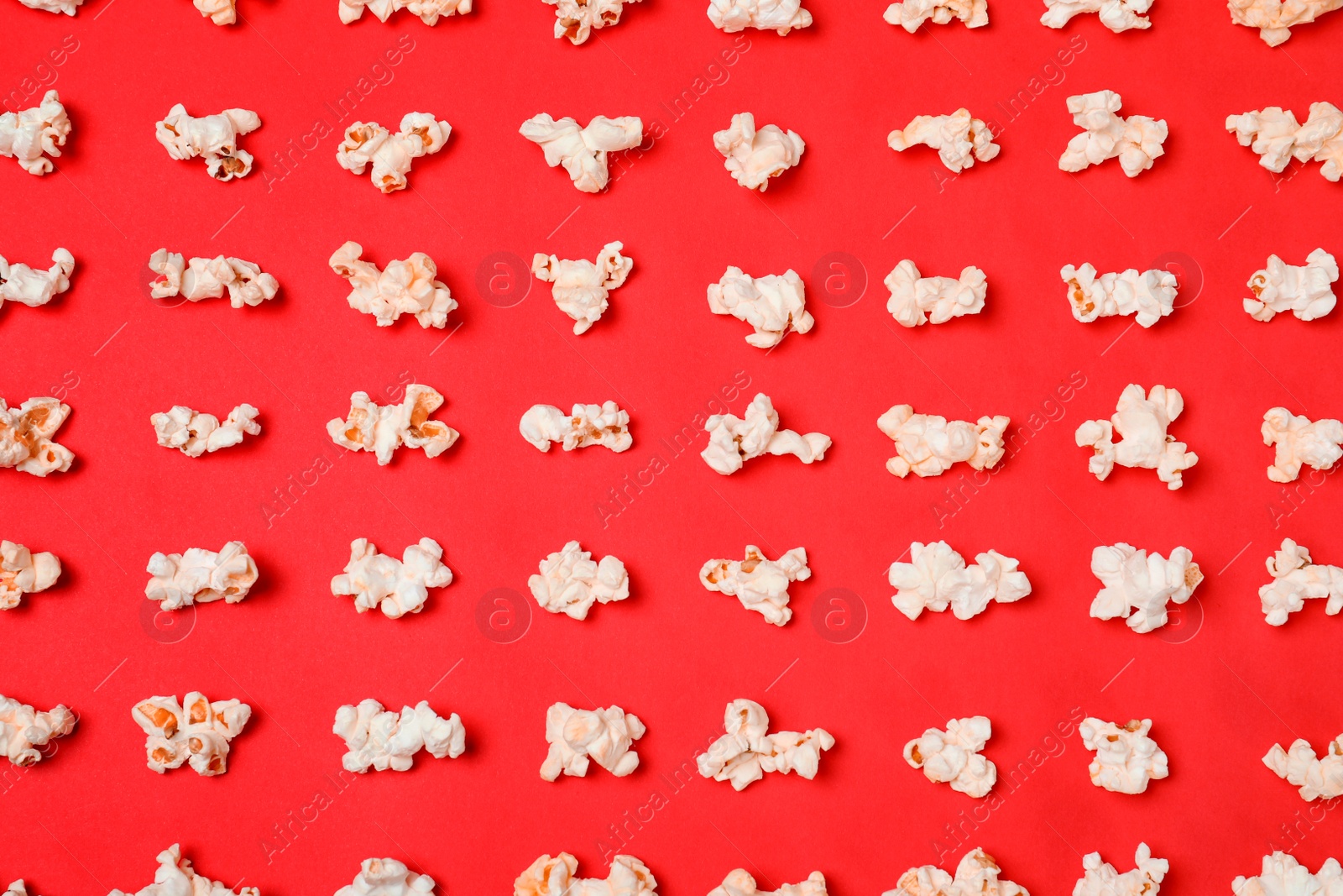 Photo of Flat lay composition with popcorn on color background