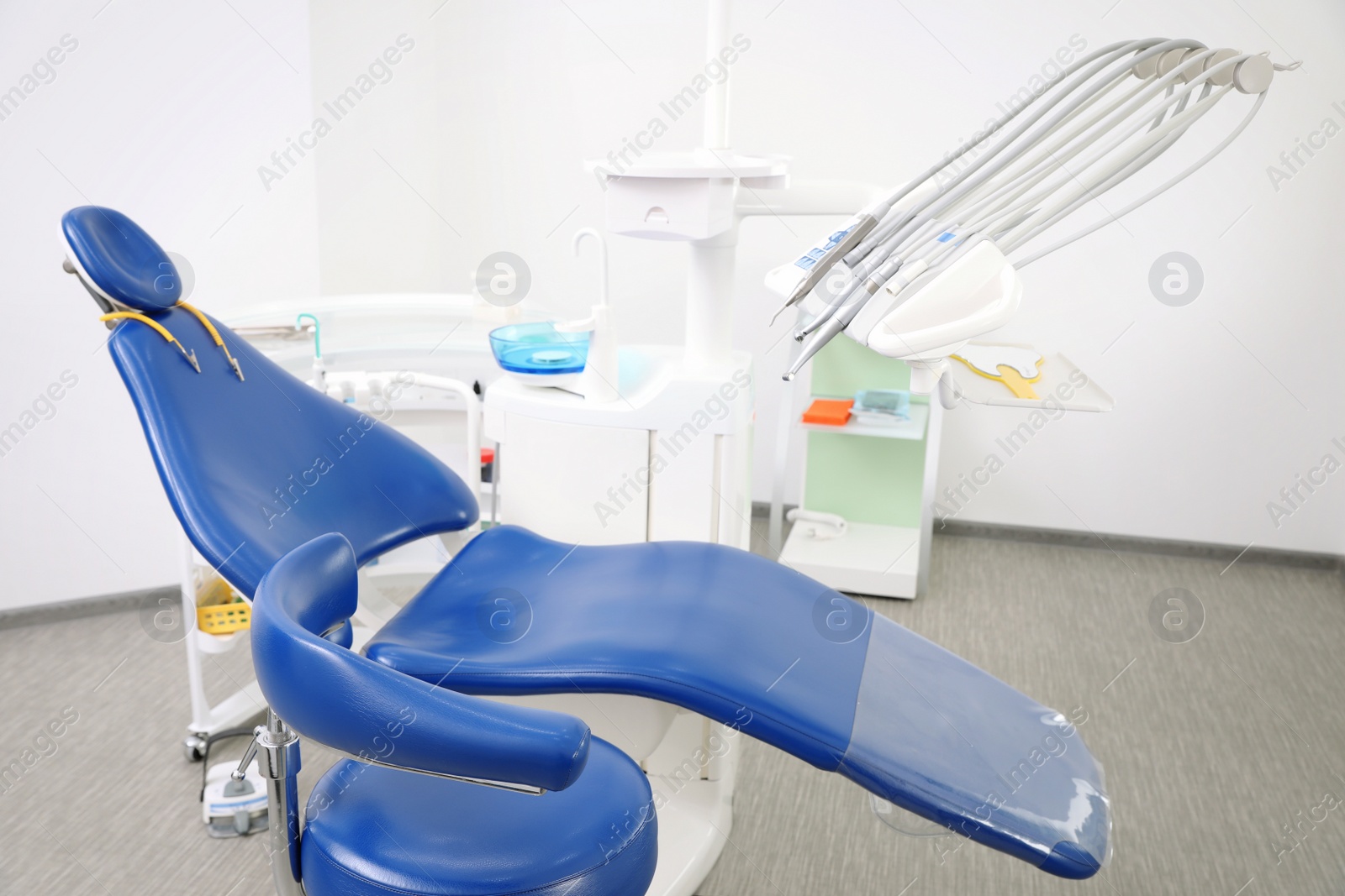 Photo of Dentist's office interior with chair and equipment