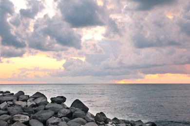 Picturesque view of sky with heavy rainy clouds over sea