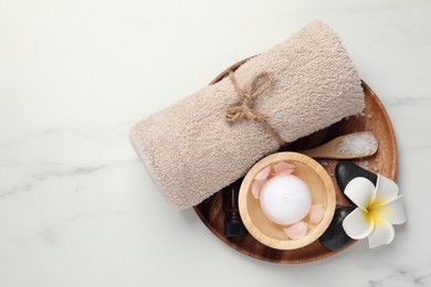 Flat lay composition with different spa products on white marble table. Space for text