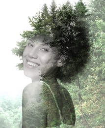 Double exposure of beautiful woman and mountain forest