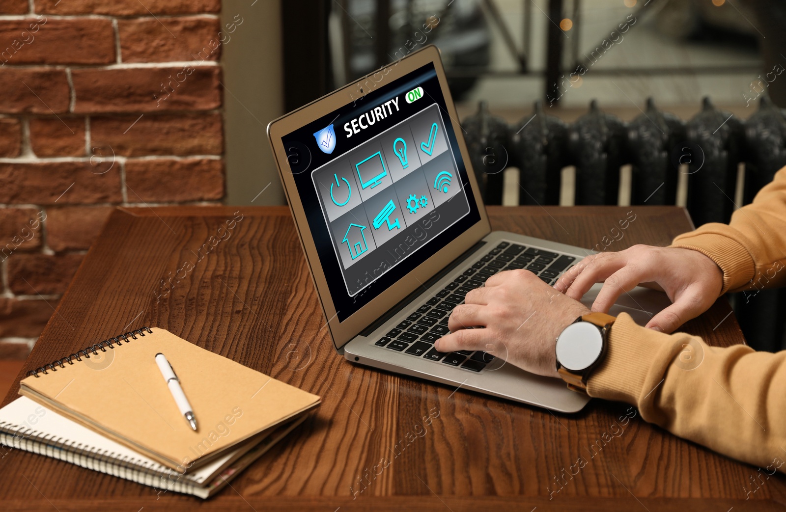 Image of Man using home security app indoors, closeup