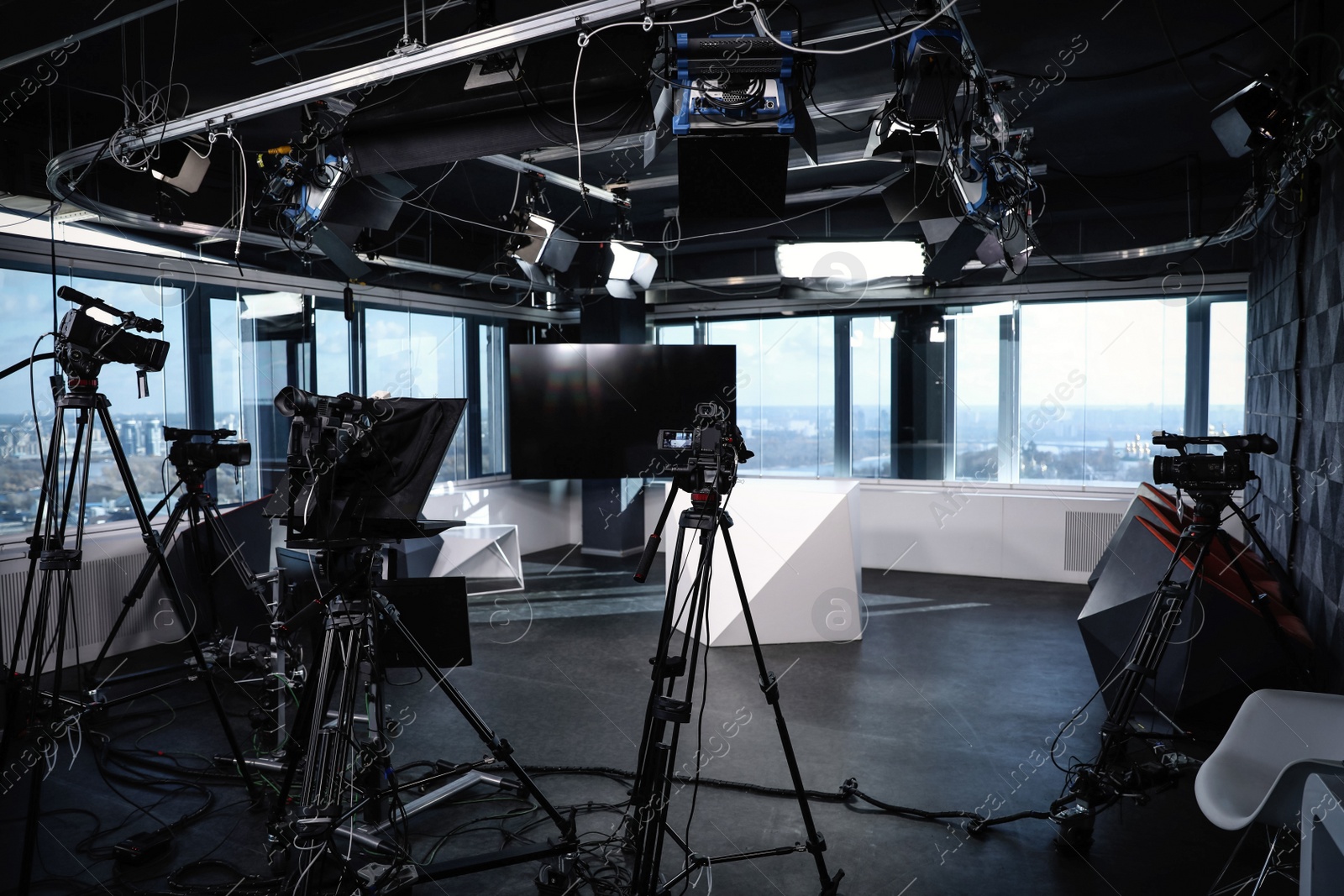 Photo of Modern video recording studio with professional cameras